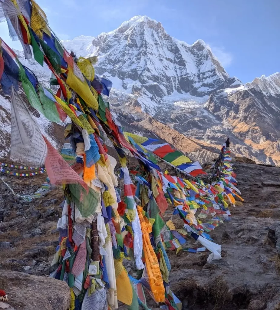 Annapurna base camp trek prayer flags at base camp with Annapurna mountain backdrop in Nepal