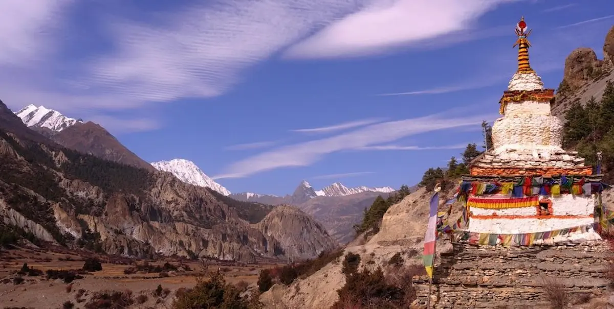 Stupa with mountain valley view on the annapurna circuit trek in Nepal